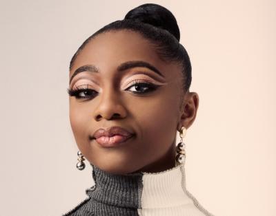 Press photo of Samara Joy wearing a black and white top.